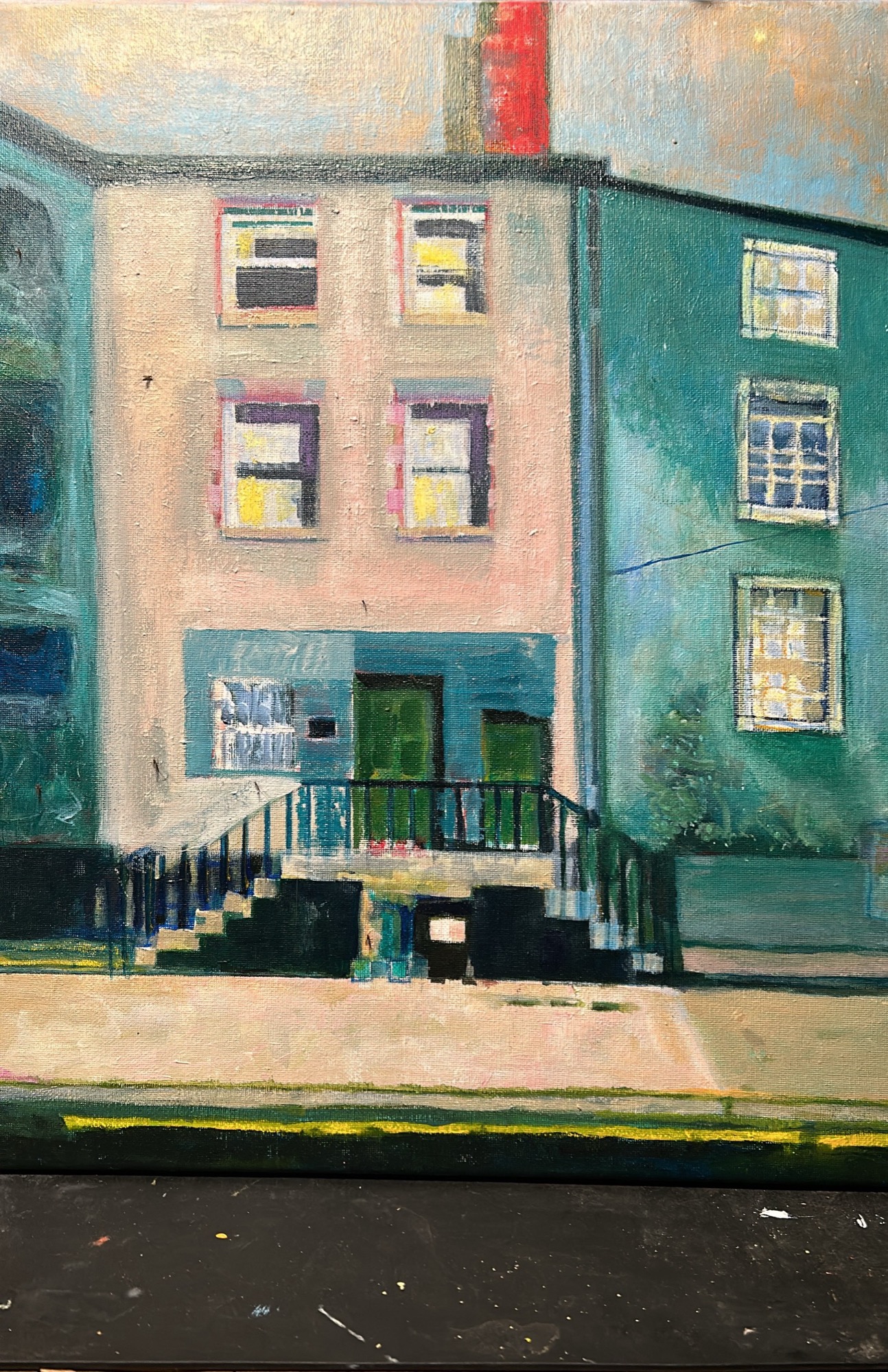 Row houses streetscape in green and pink